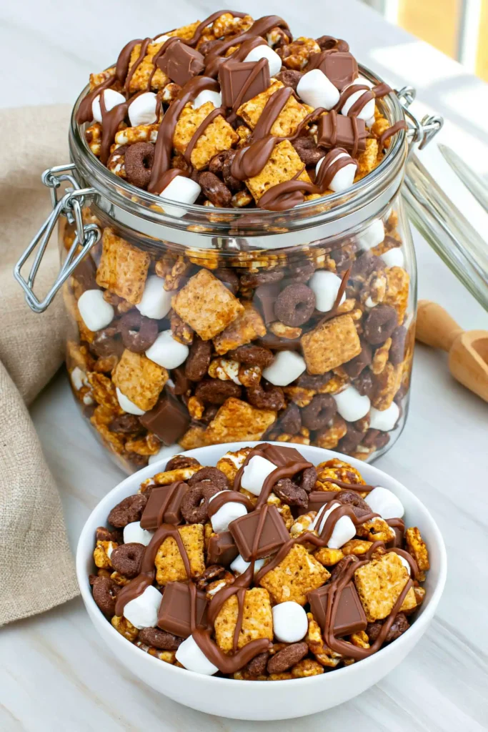 S’mores Snack Mix for an Easy No-Bake Treat 9 S’mores Snack Mix stored in an airtight glass container