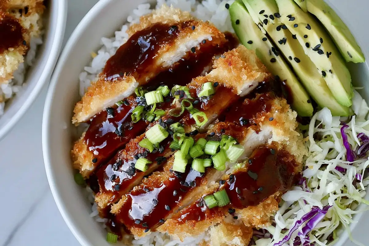 Japanese Katsu Bowls with Crispy Sheet-Pan Chicken 1 Mohamed Ayad's Japanese Katsu Bowls Recipe with crispy sheet-pan chicken, rice, slaw, avocado, and tonkatsu sauce