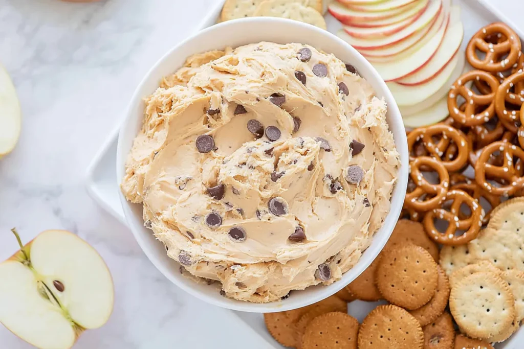 Mixing peanut butter cookie dough dip ingredients in a bowl with hand mixer