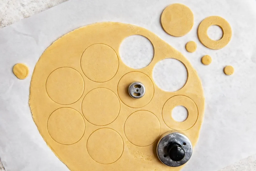 Samoas Cookies Copycat cut-out shortbread cookie rings on rolled dough