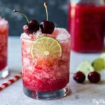 Cherry Limeade ingredients with fresh cherries limes honey and homemade syrup