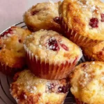 Mohamed Ayad's Cherry Muffins Recipe with golden tops and juicy cherries
