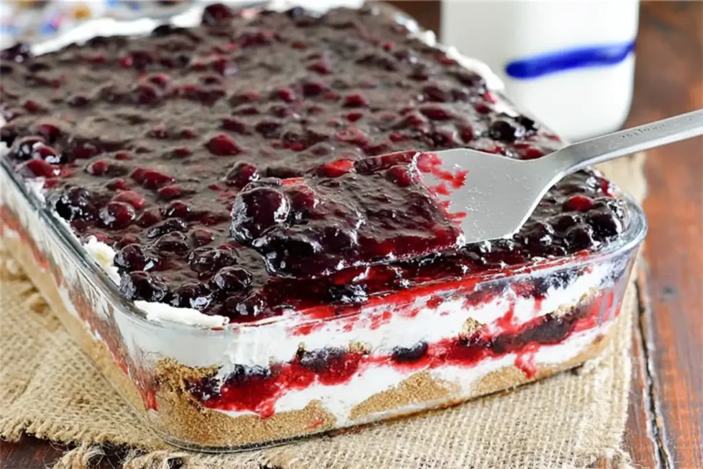 Blueberry pie filling layer in mixed berry yum yum dessert