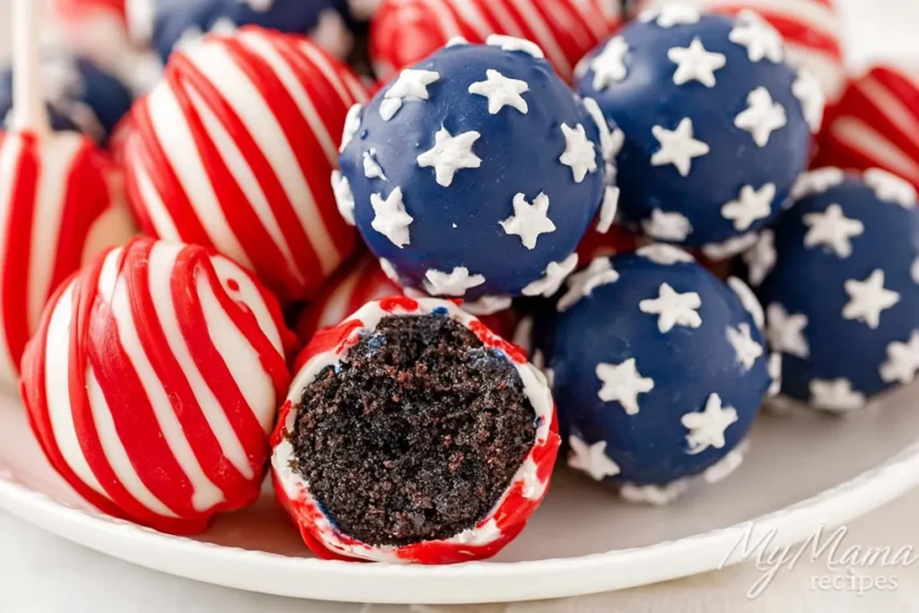 Patriotic Oreo balls on a white platter with red drizzle and blue star sprinkles